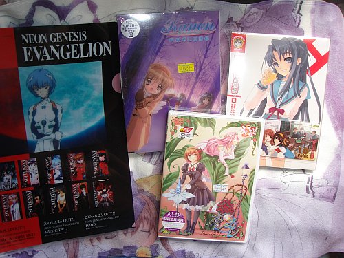 Kashimashi DVD 5, Kanon Prelude DVD, Suzumiya Haruhi no Yuuutsu DVD 2, on the left is Evangelion something something paper holder