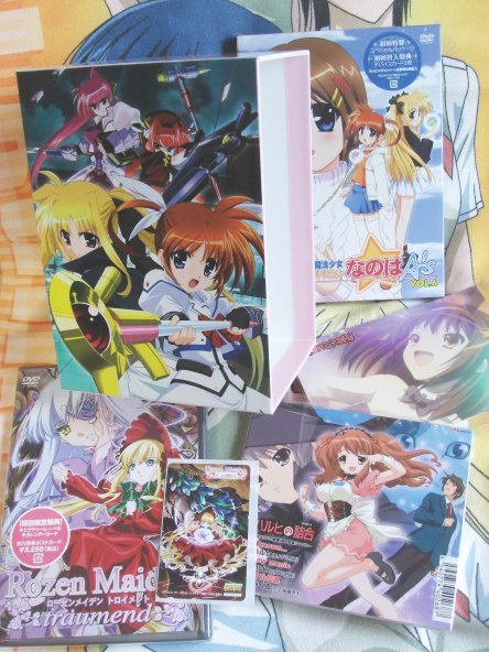Nanoha A's DVD and DVD box omake, Rozen Maiden Telephone Card and DVD, Suzumiya Haruhi no Tsumeawase CD and postcard