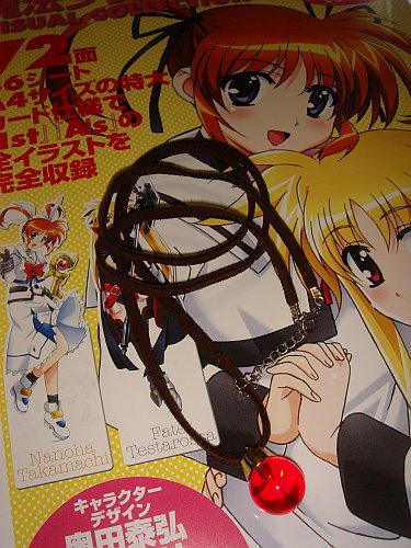 Mahou Shojo Lyrical Nanoha A's Raising Heart necklace and Visual Collection book